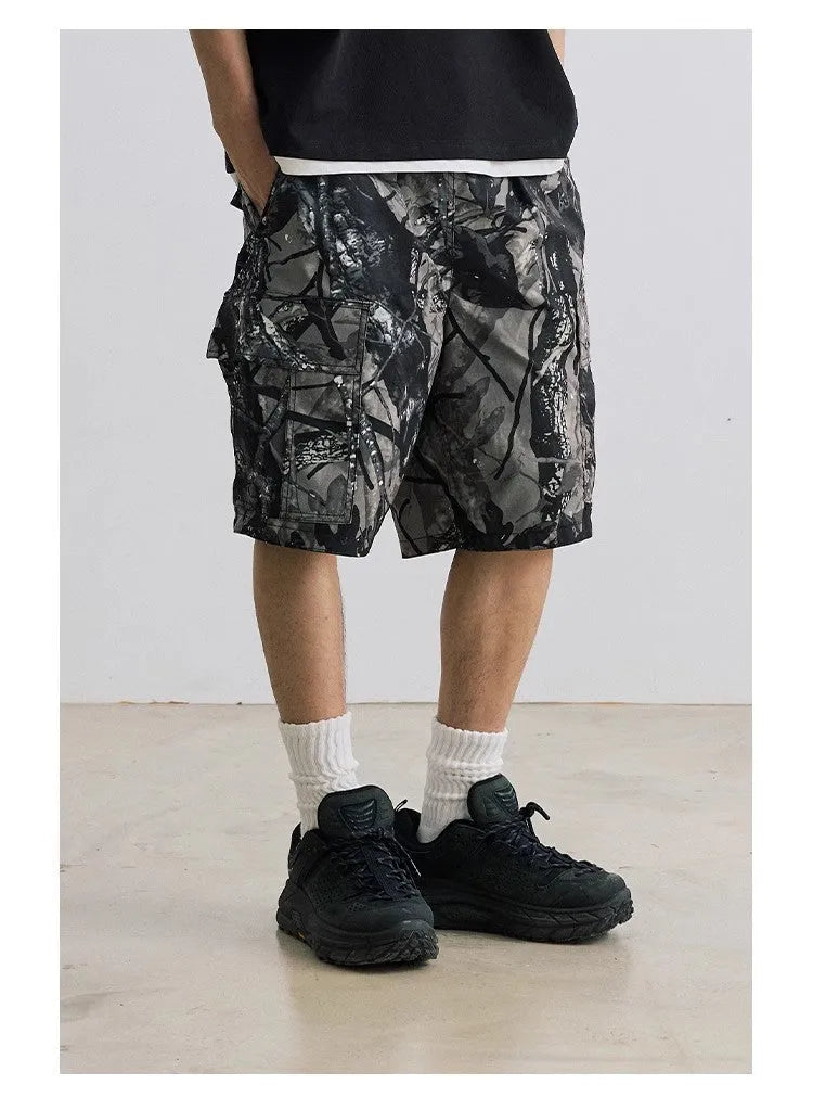 Loose casual straight-leg denim shorts in army green with a zip fly and elasticated waistband.