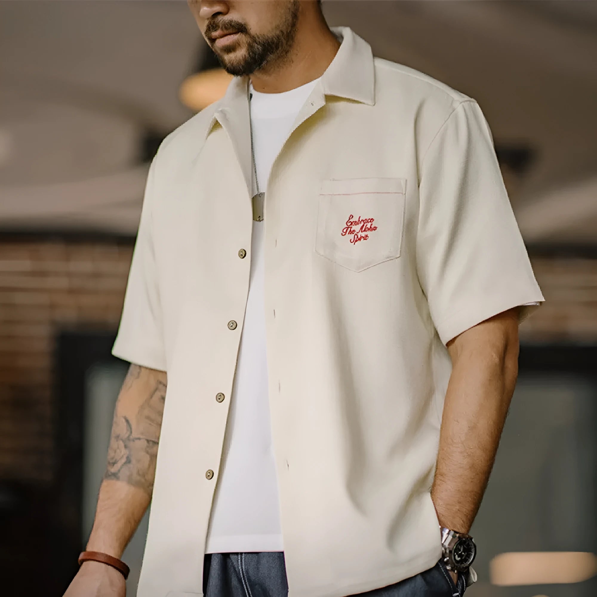 Light apricot men's Cuban collar shirt with bamboo pattern showing plants and flowers design