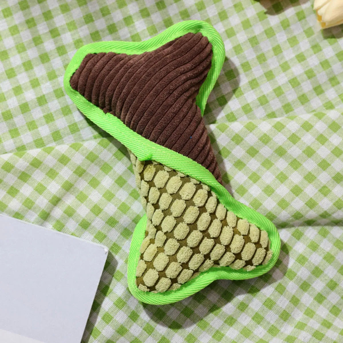 Blue teddy dog toy with a squeaking bone model and corn fleece lining.