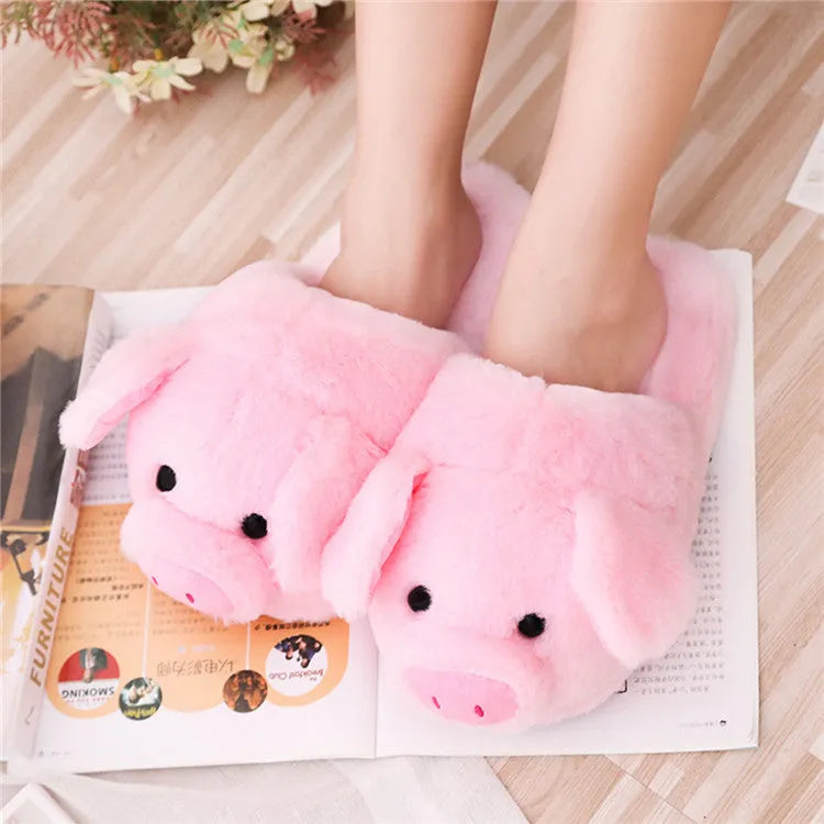 Pink pig design floor slippers with plush lining shown from side view