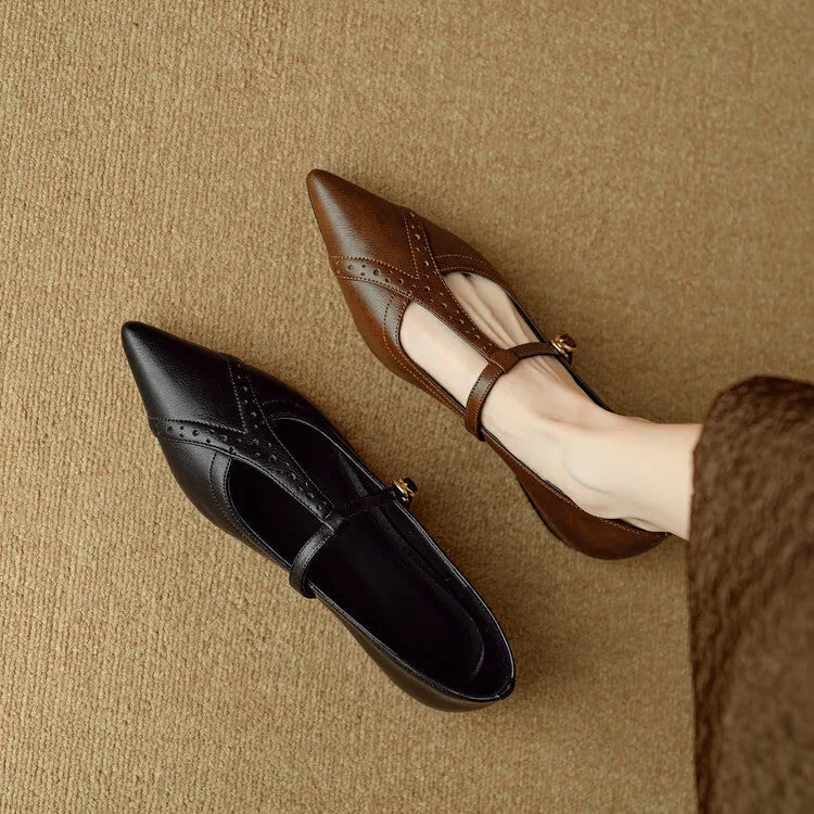 Brown women's casual cowhide flat shoes with round toe and soft bottom, shown with a skirt.