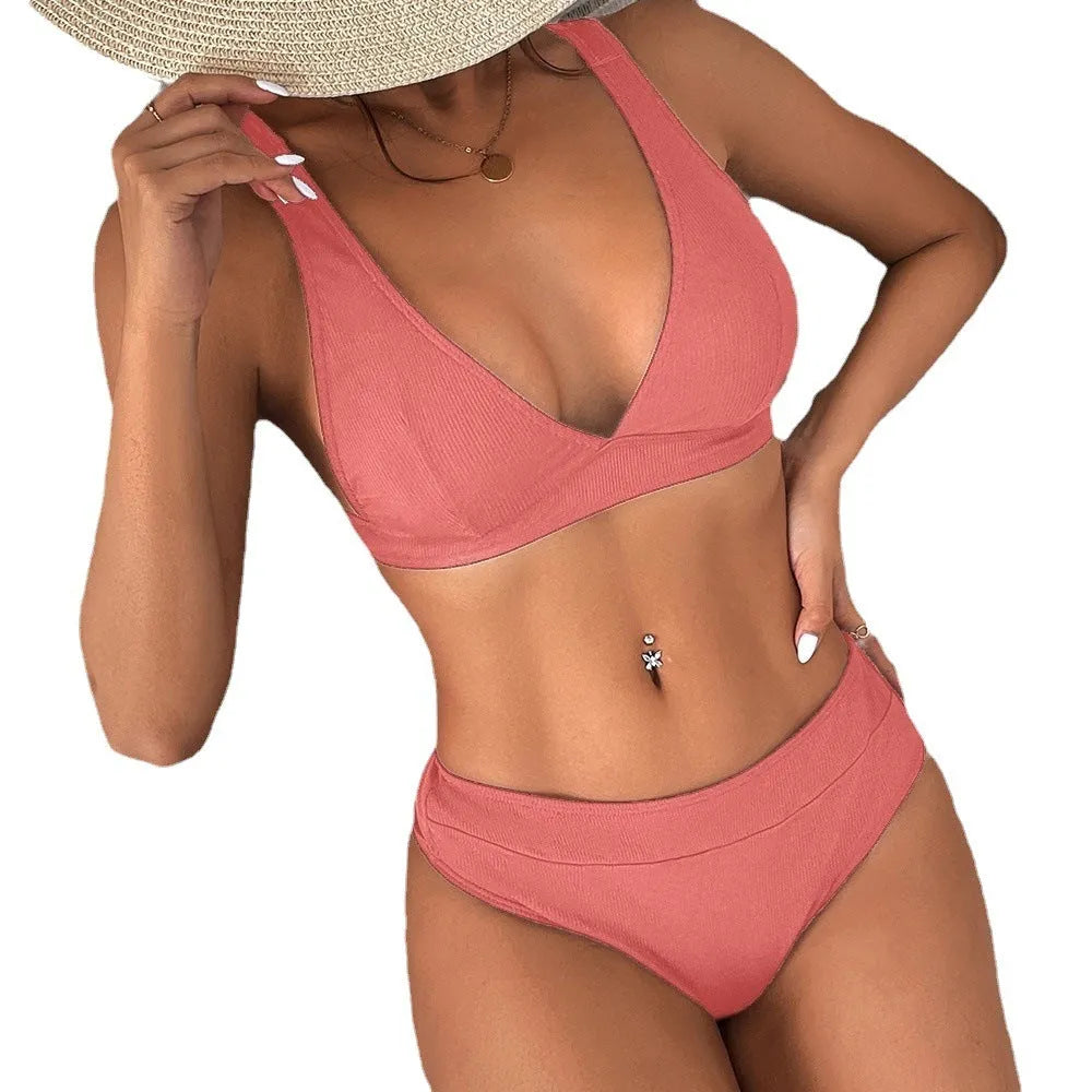 Women's black rib lace-up bikini set with high-waist split bottom on mannequin