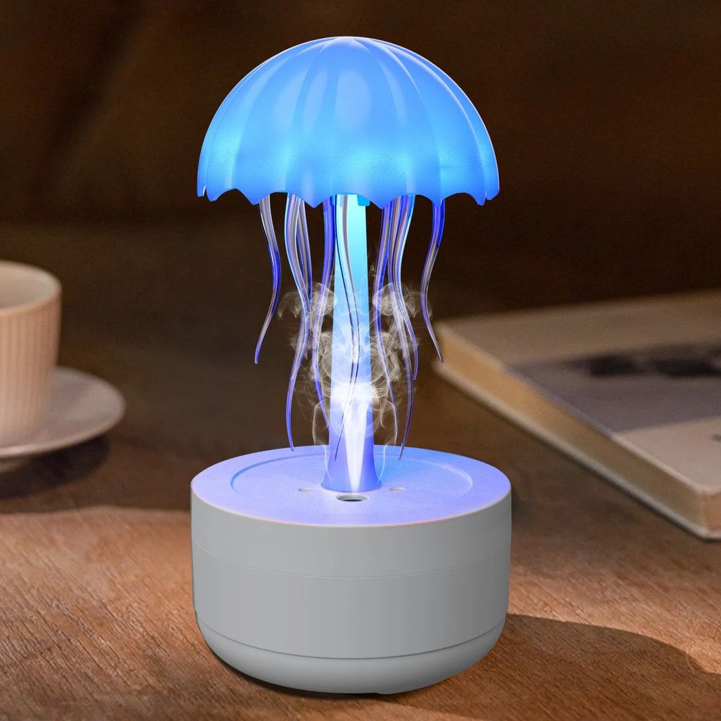 White jellyfish-shaped humidifier and essential oil diffuser with colourful LED lights on a desktop