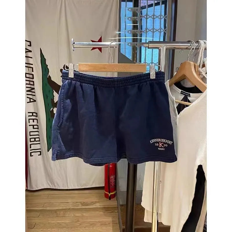 Women's dark blue cotton sports hot pants with white flag embroidery, shorts length design