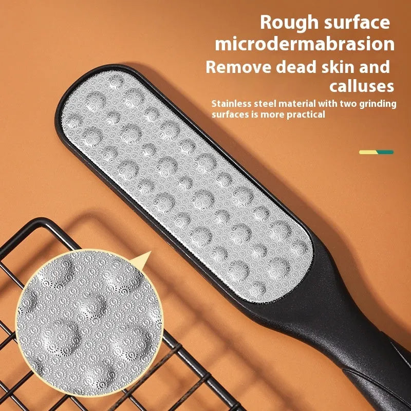 Stainless steel foot grinder tool with white and black double-sided sandpaper files for callus removal.
