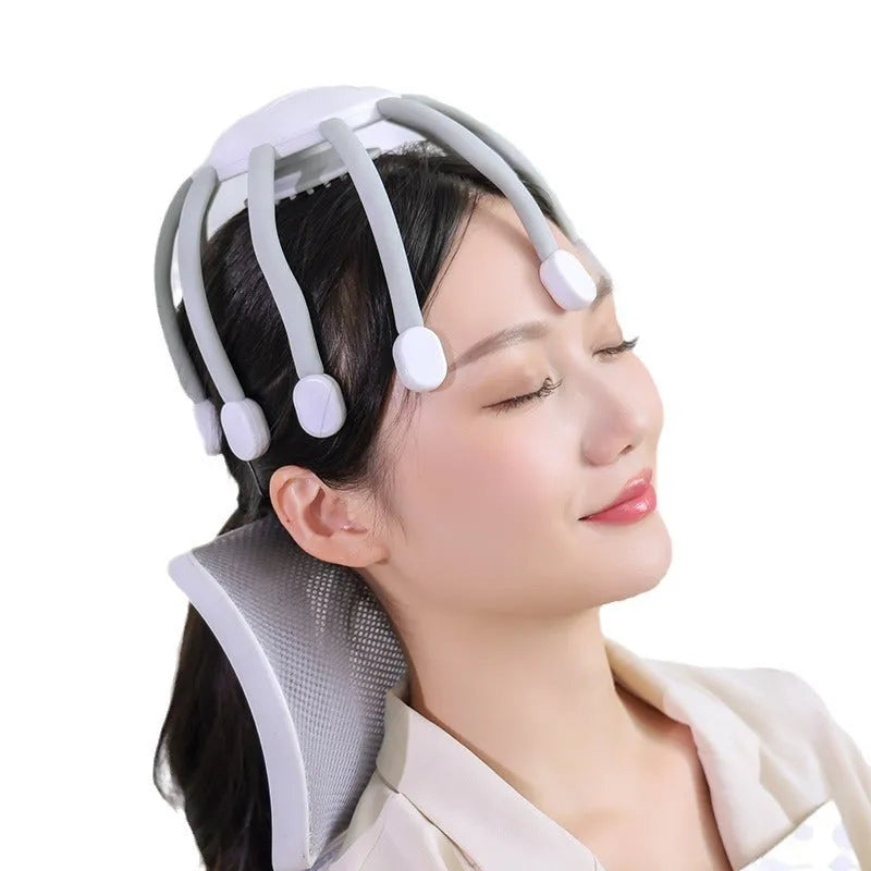 Black head massager with multiple vibrating claws on a scalp, showing four speed mode buttons and USB charging port