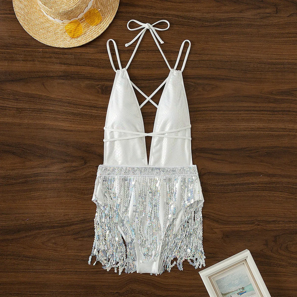 White one-piece swimsuit with deep V-neck and tassel trim, sleeveless briefs style