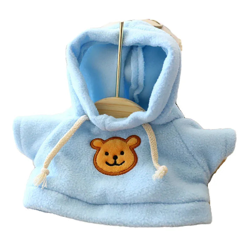 A selection of dog sweaters and hoodies in blue, pink, red, yellow, brown, and grey bear designs, shown in medium and large sizes.