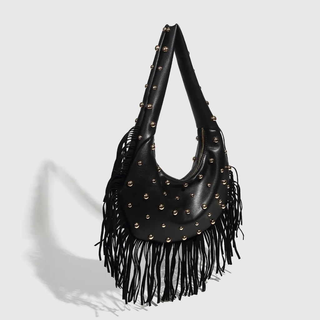 Retro style black shoulder handbag with a tassel decoration, shown with interior mobile phone pocket.