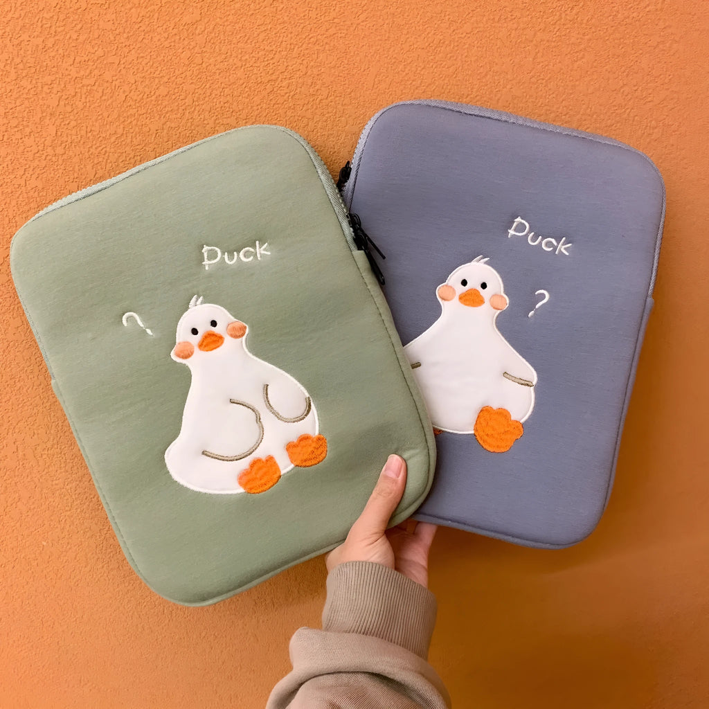 Blue cotton tablet case with embroidered cartoon duck design and zipper opening