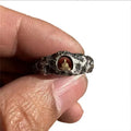Copper Buddha ring with textured grotto surface showing hand-forged details and retro styling