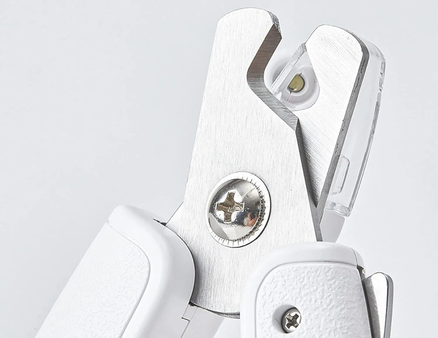White pet nail clippers with LED light, transparent anti-splash baffle, and a nail file.