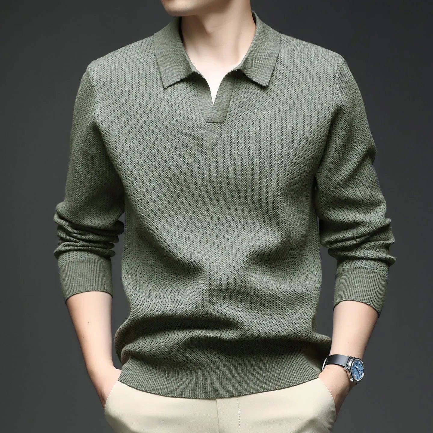 Men's loose fit plain pullover sweater in green, shown on a model for scale.