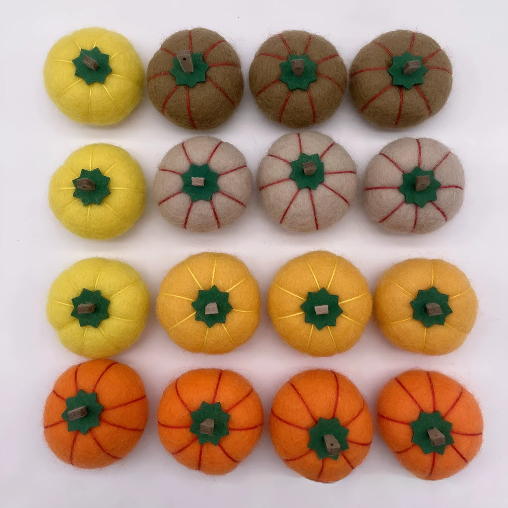 Wool felt pumpkin ornament in assorted colours for dollhouse decoration, approx. 5cm wide.