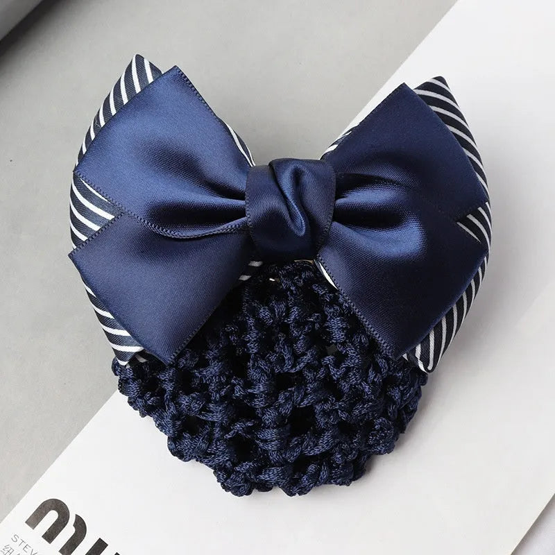 Professional hair clip with a black net pocket and a red flower bow ornament on a white background.