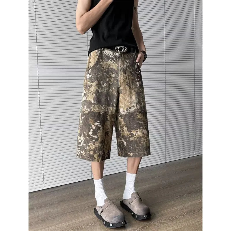 Yellow snake camouflage cropped jeans on a denim background