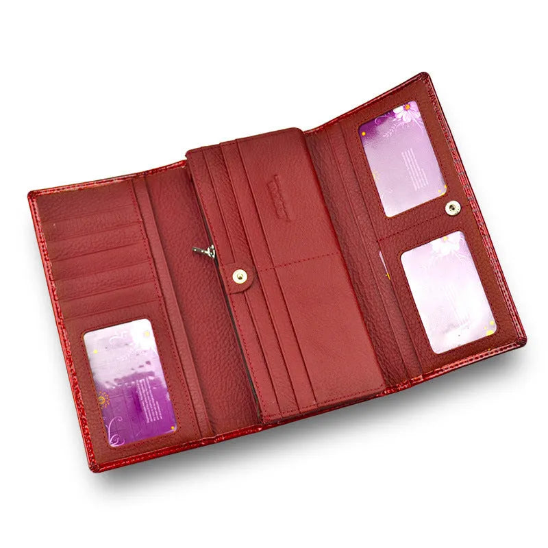 Women's red patent leather coin purse with crocodile pattern texture.