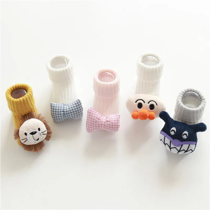 Baby socks in cotton fabric showing Lion, Panda, Blue Bow, and Pink Stars designs for sizes XS, S, M.