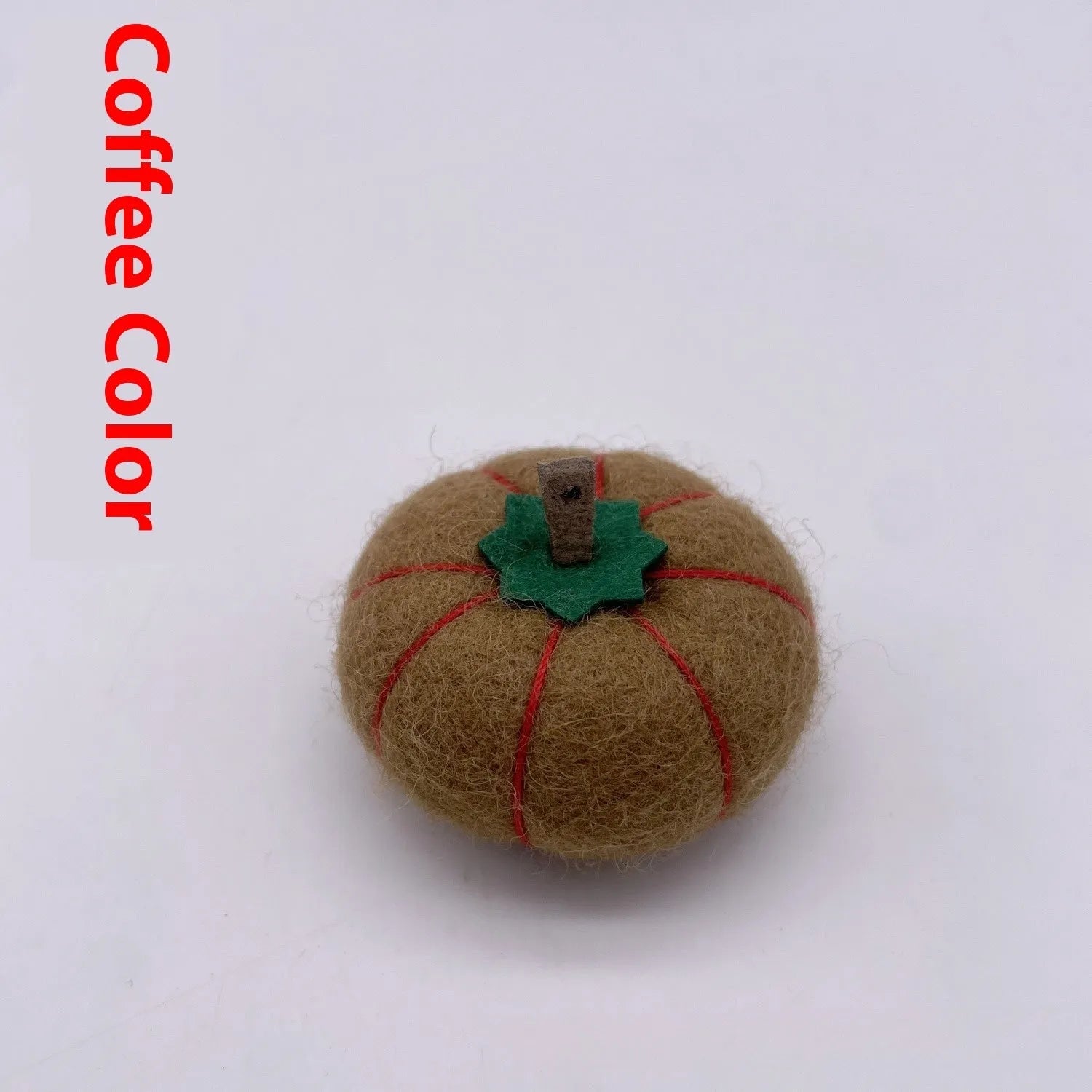 Wool felt pumpkin ornament in assorted colours for dollhouse decoration, approx. 5cm wide.
