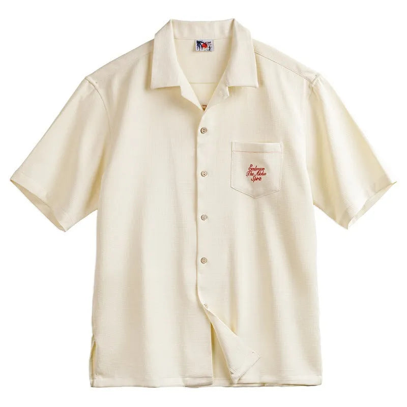 Light apricot men's Cuban collar shirt with bamboo pattern showing plants and flowers design