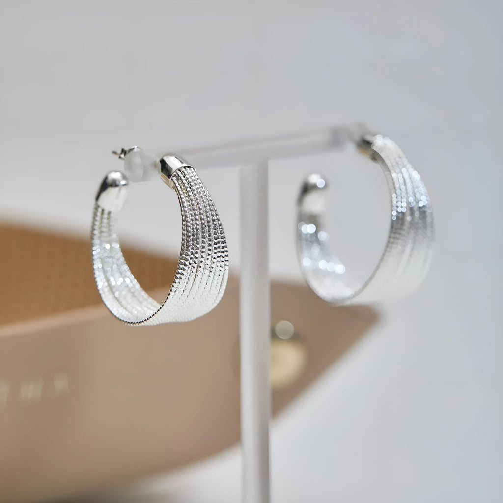 Multi-layer geometric bracelet earrings in gold and silver colour options as studs and clips
