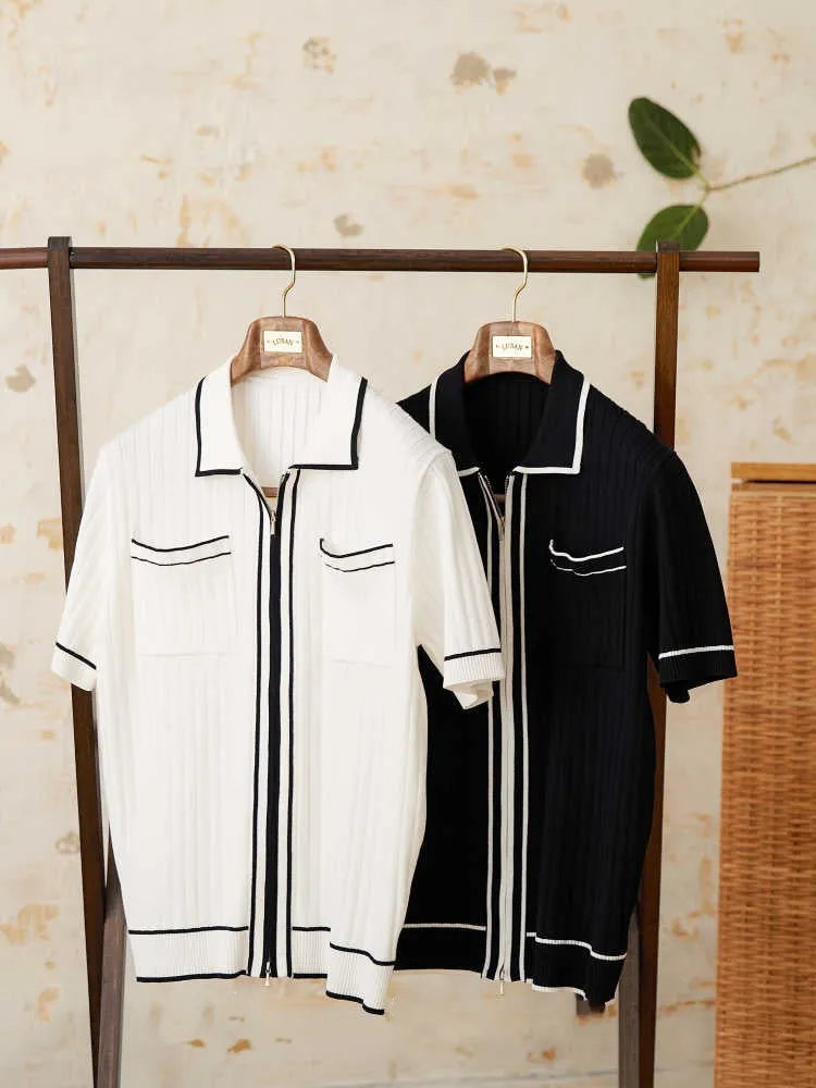 Slim fit black polo shirt with short sleeves and a lapel collar on a mannequin.
