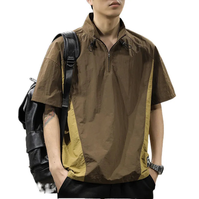 Brown men's half-zip stand collar short sleeve casual shirt laid flat, showing fleece lining and loose fit.