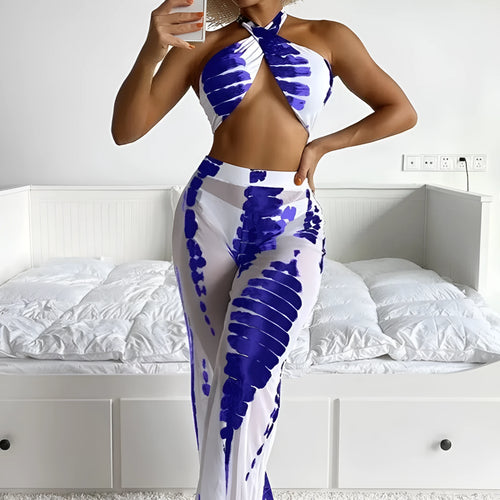 Women's black print three-piece bikini set with mesh trousers, top, and underpants on a mannequin.