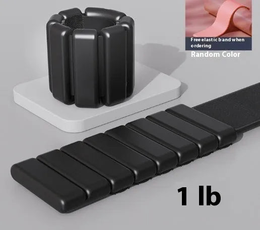 Adjustable silicone fitness bracelet with detachable 1lb or 2lb weight options in pink, black, grey and blue.