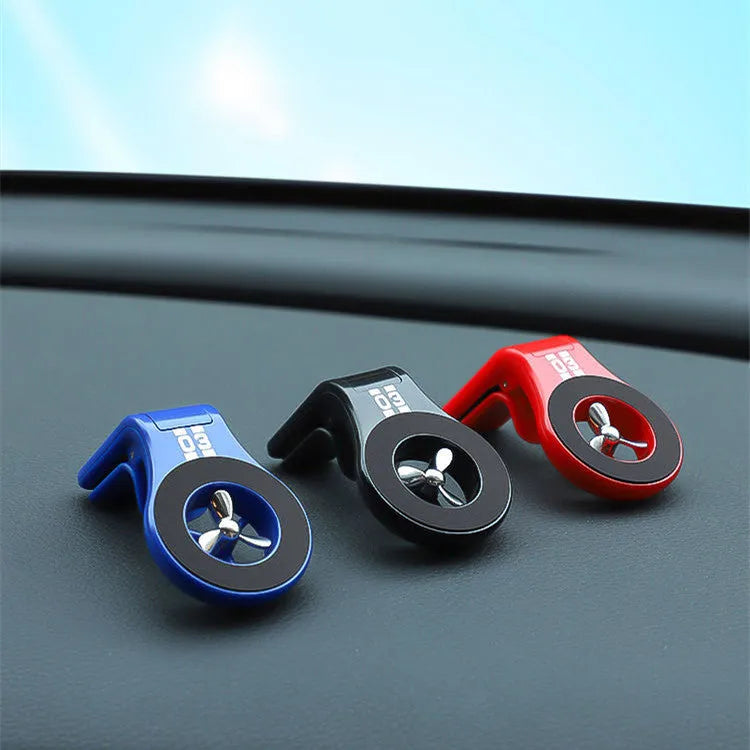 Black magnetic car air vent phone holder with adjustable clip and perfume slice attached
