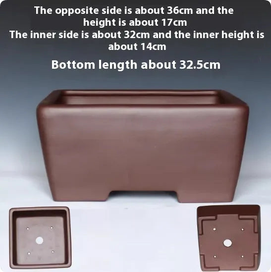 A square purple clay flower pot for succulents or bonsai plants on a tabletop.