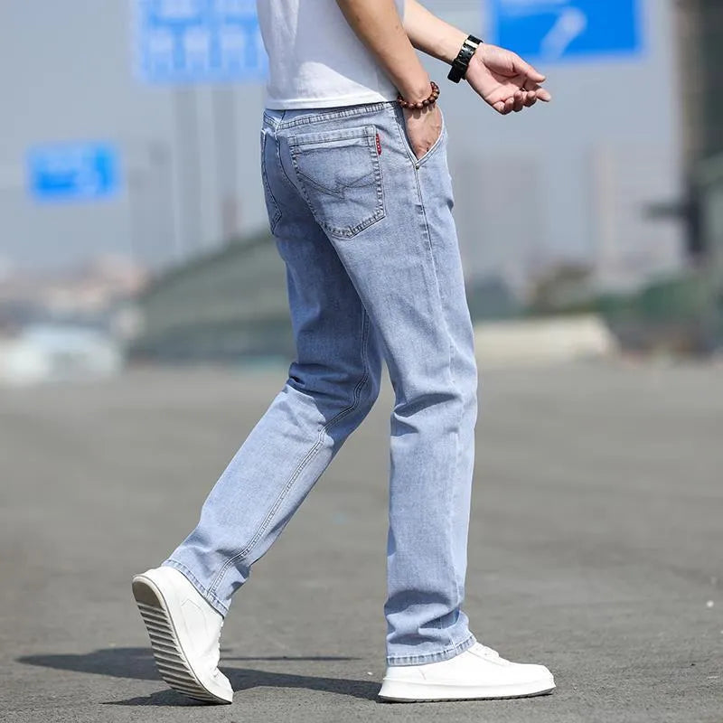 Men's straight leg jeans in smoky grey colour with a low waist and zipper fly