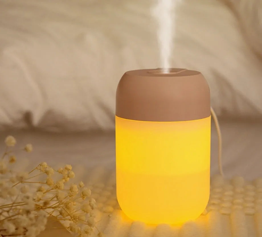 White cylindrical mini humidifier with USB cable for small room aromatherapy and humidification