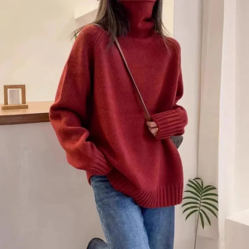 Red loose-fit women's turtleneck sweater with thick knit and a textured curling collar.