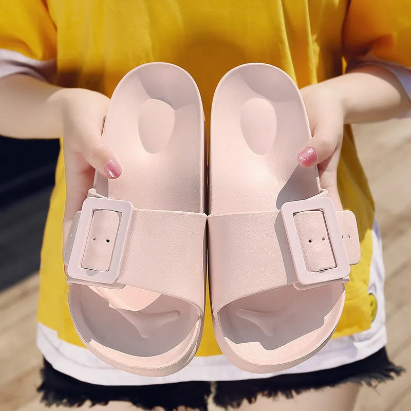 Women's grey blue flip-flop slippers with a buckle strap on a soft EVA sole.