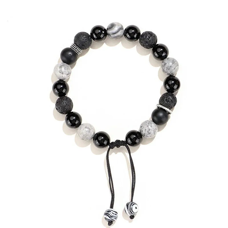 A black agate map stone volcanic rock bracelet with diamond-shaped beads in a New Chinese style unisex design.