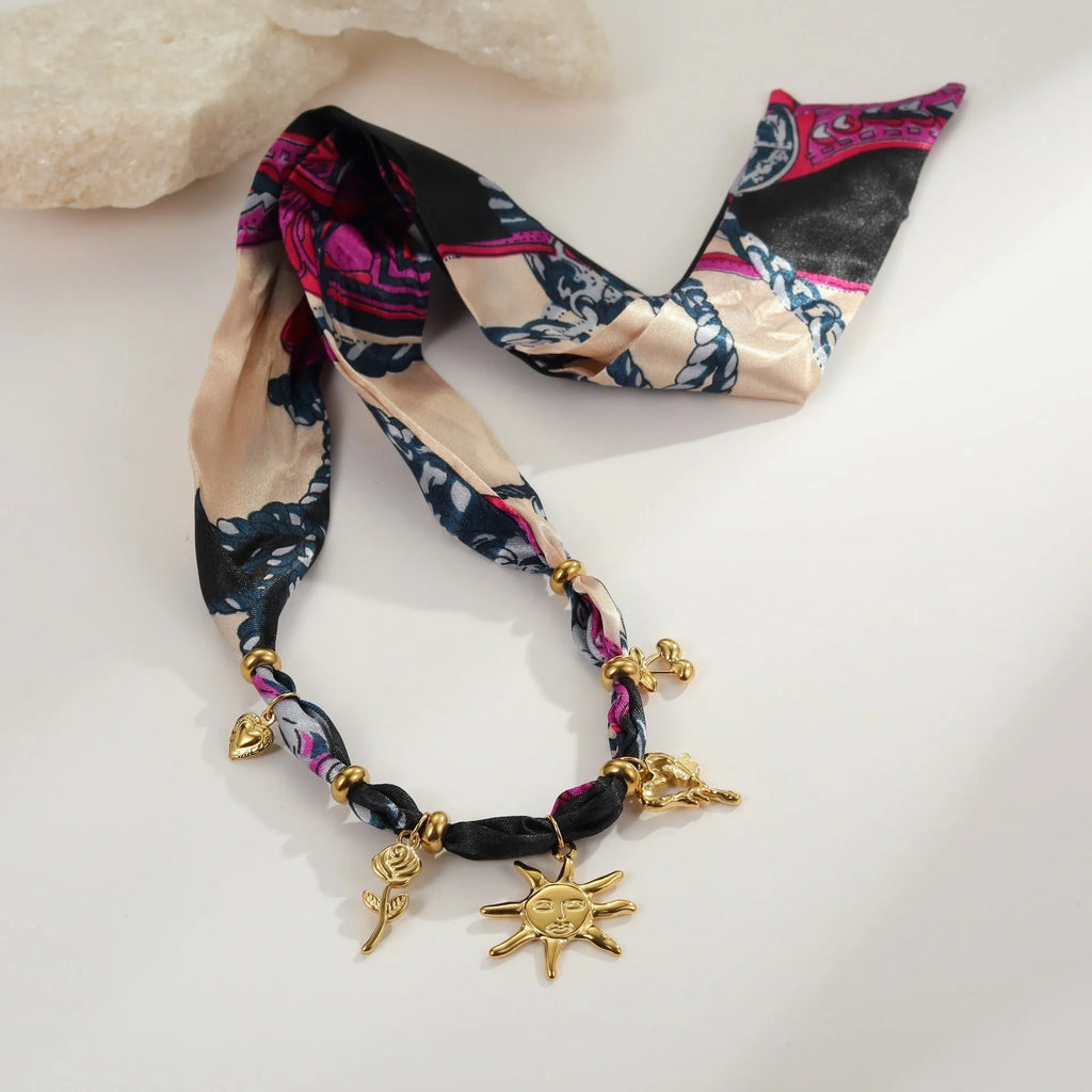 Stainless steel necklace or bracelet with geometric sun pendant on a regular chain, 18K plated.