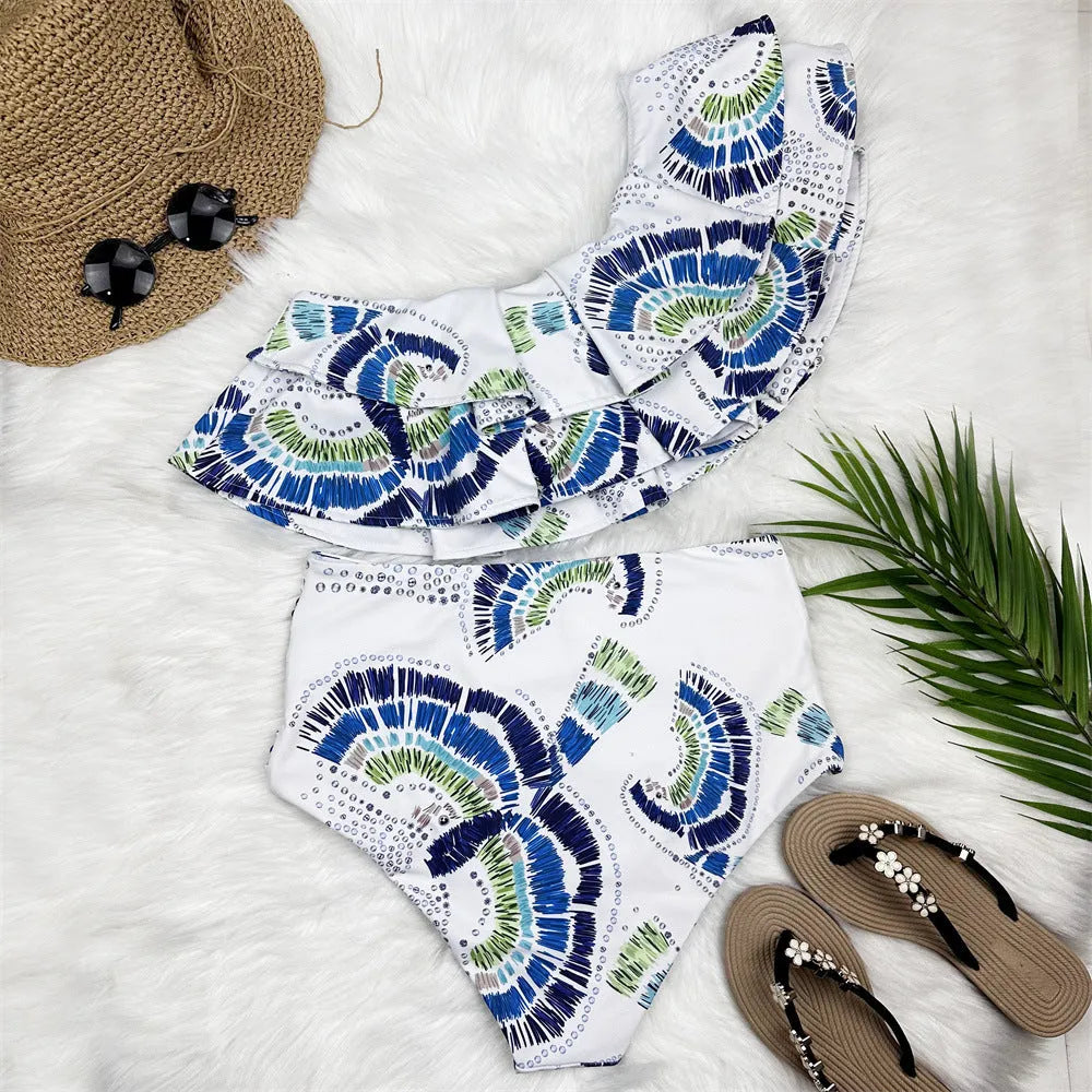 White women's one-shoulder bikini swimsuit with lotus leaf detail and split design