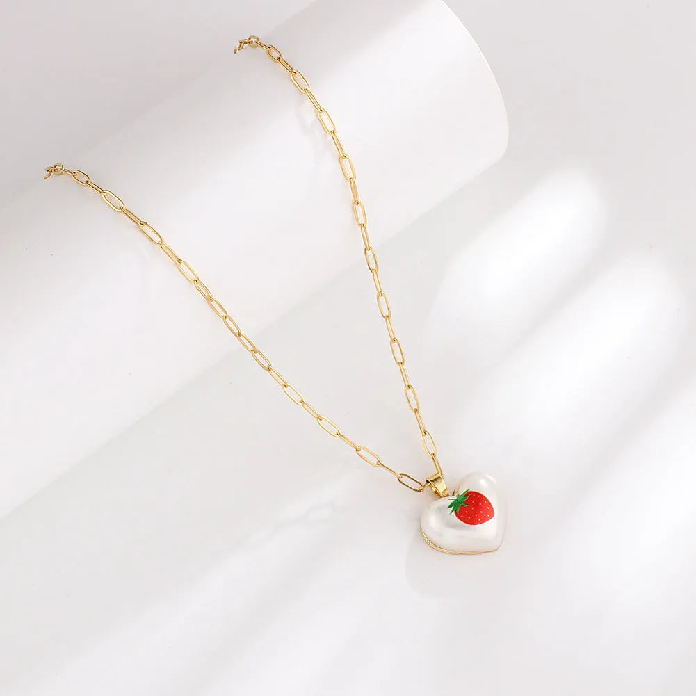 Silver tone heart necklace with geometric fruit pendant on adjustable 21-50cm chain