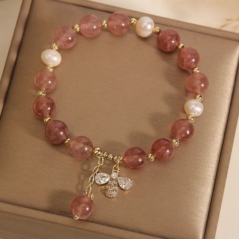 Freshwater pearl and strawberry quartz bracelet with zircon flower charms