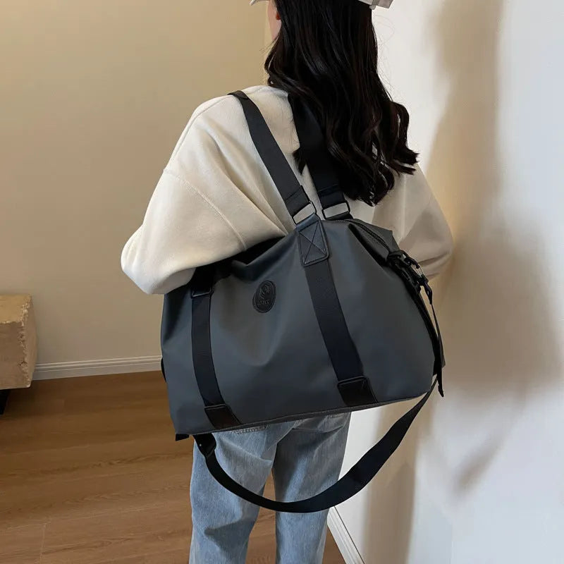 Waterproof Oxford cloth travel bag in solid colour with 36-55 litre capacity for short-distance trips
