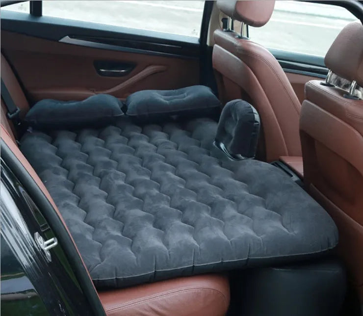 Thick flocking inflatable car air bed set with pump and pillows for five-seater vehicles.