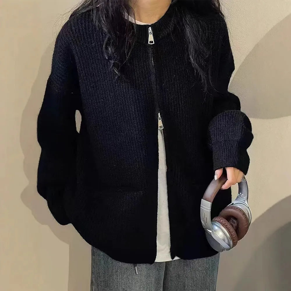 Beige viscose fibre soft wind cardigan coat with long sleeves on a hanger.