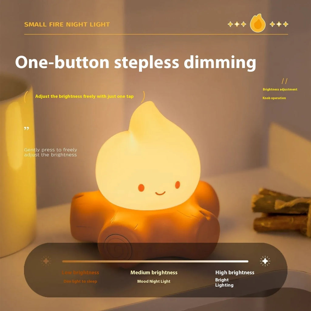 Silicone Small Fire Pile cartoon night lamp with yellow light on a surface