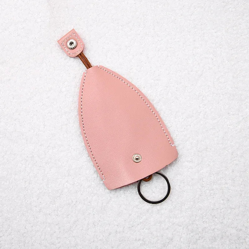 Cartoon pull-out key case in PU leather showing design options including resin fruit and big cartoon animal prints.