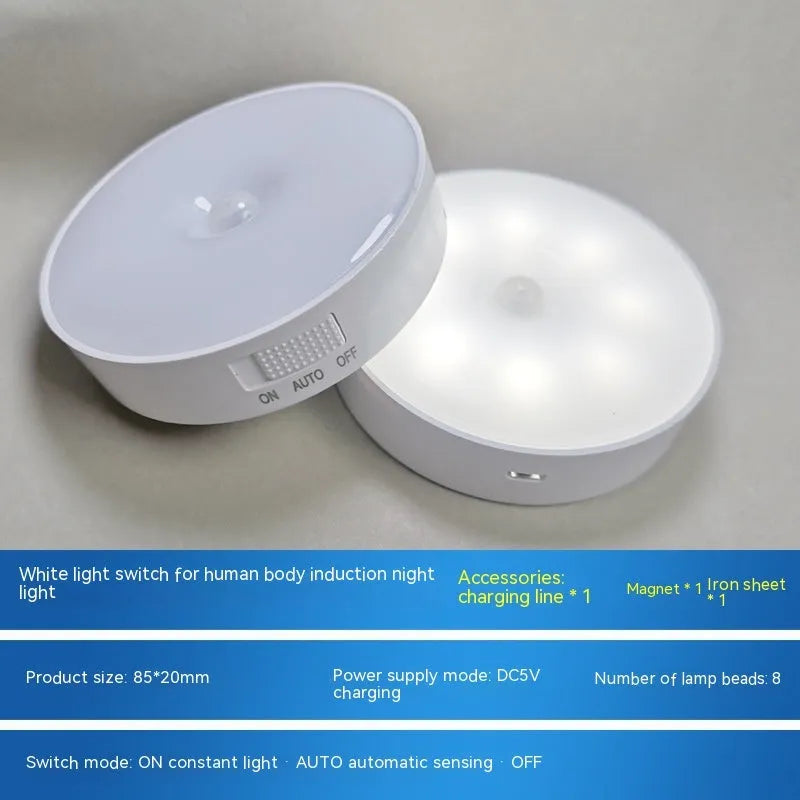 Compact round motion sensor LED night light with USB charging cable and adhesive mounting tape