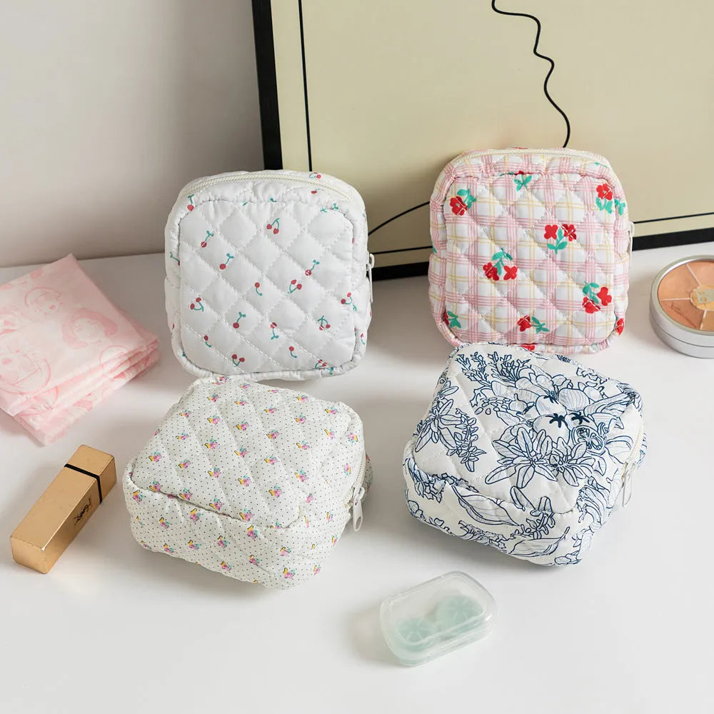 Floral polyester key storage bag with sewing thread detailing in multiple colour patterns