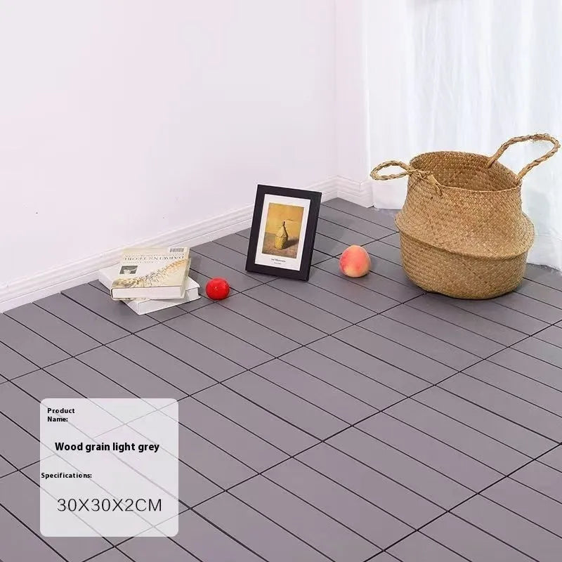 Wood grain plastic floor tiles in brown, grey and orange colours showing non-slip texture