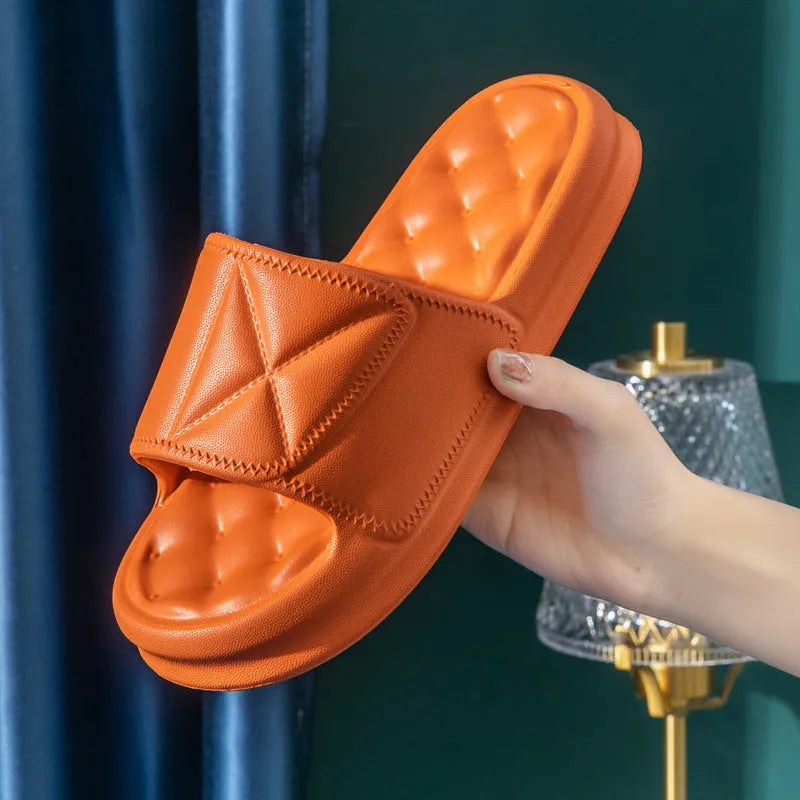 A pair of soft EVA bathroom slippers with a thick non-slip sole, shown in a choice of colours.