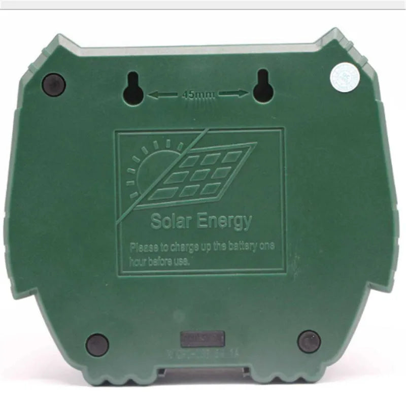Green solar ultrasonic animal repeller unit with solar panel on top.